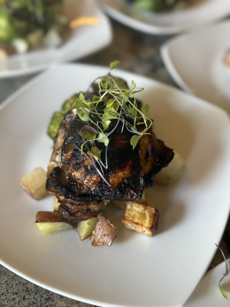 Stacked entree with microgreens