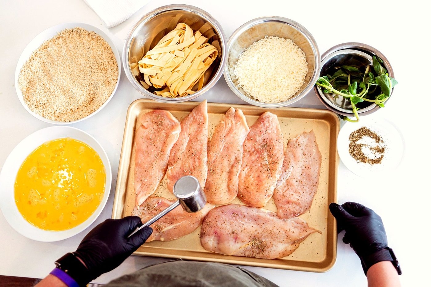Mise en place ingredient preparation for a private chef tasting menu